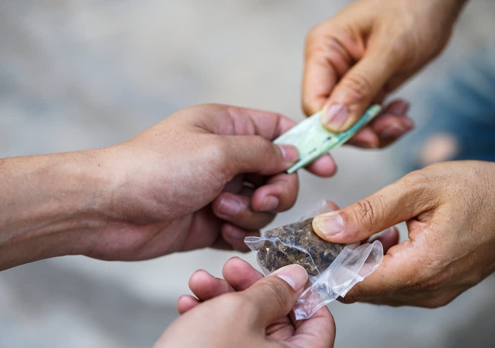 Drug addict buying narcotics and paying,Drug trafficking stock photo