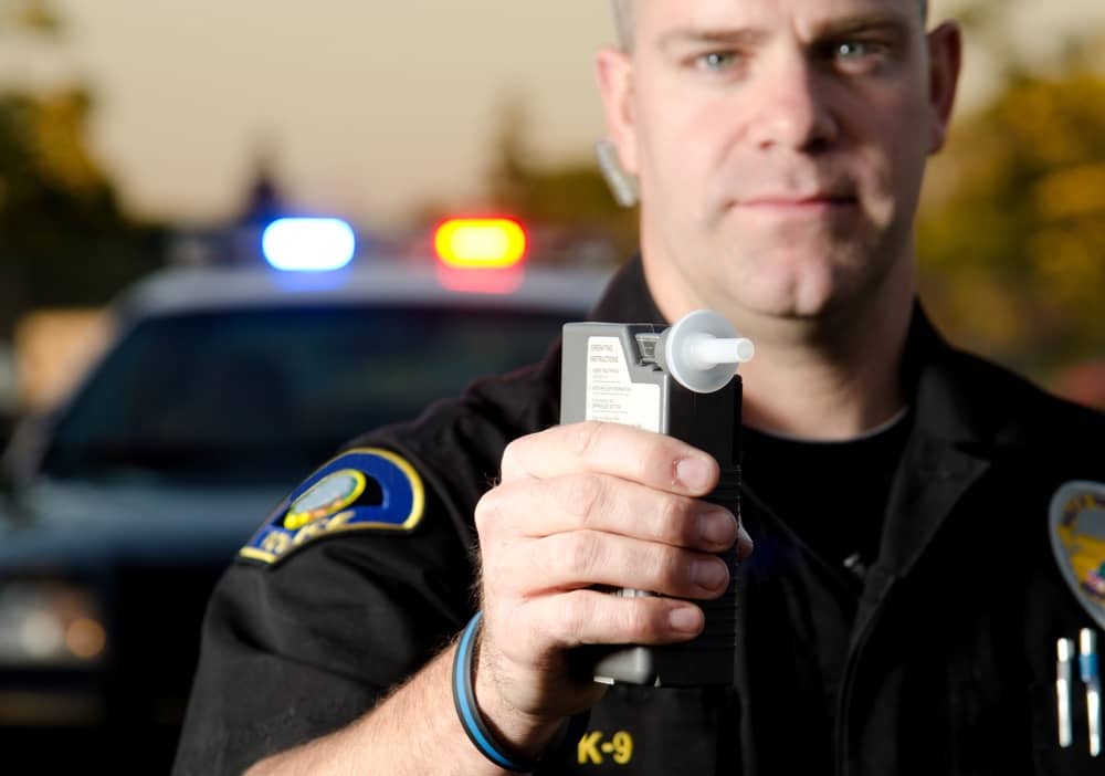 officer giving breathalyzer test