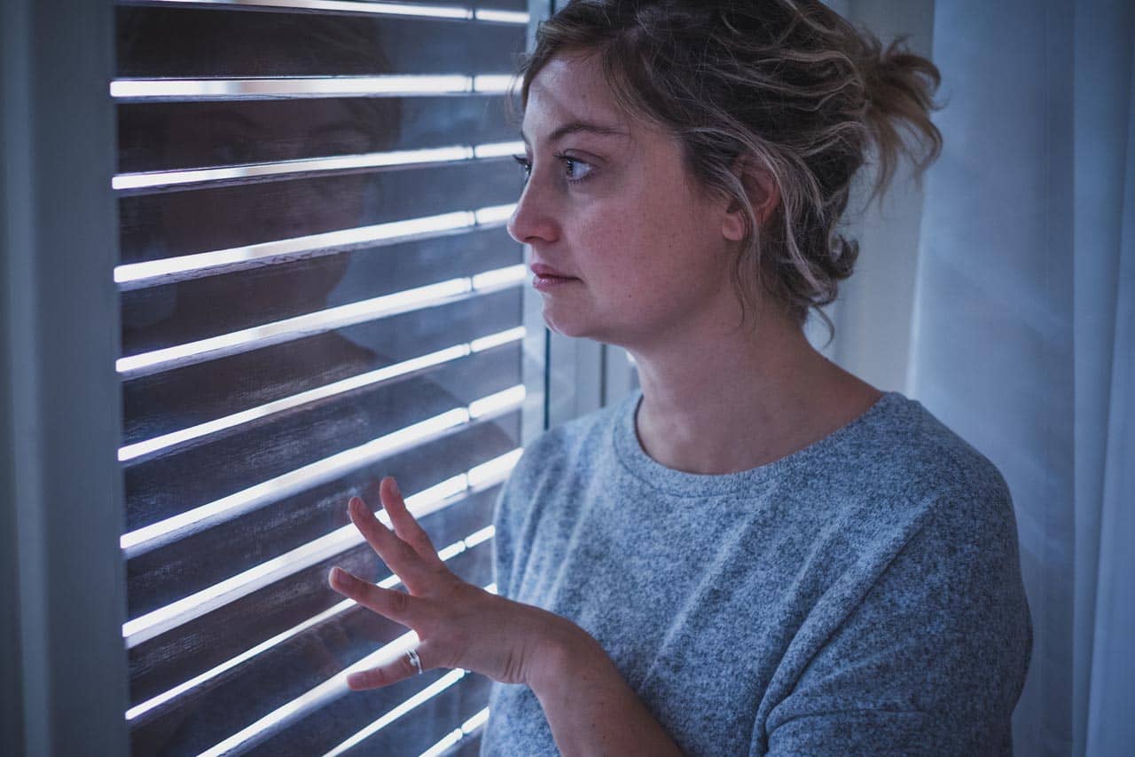 Sad Woman Looking Out Window