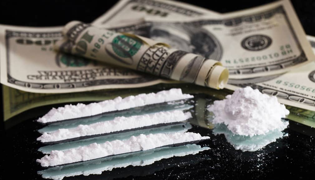 Lines of cocaine and dollar bills